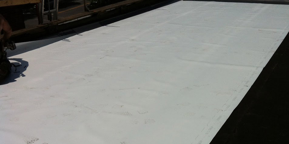 Installation de toiture membrane élastomère à Montréal - Toiture Laurentides